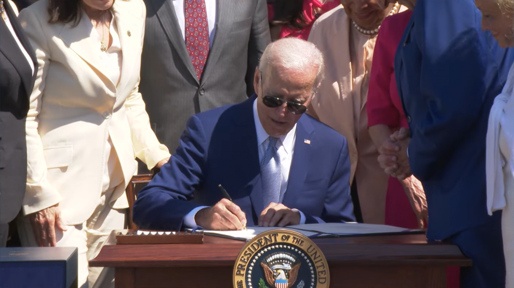 Biden signing the CHIPS and Science Act of 2022